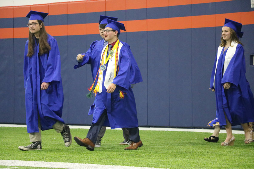 STEM School Highlands Ranch graduates stride into the Broncos Training Facility on May 20 for the 2019 commencement ceremony.